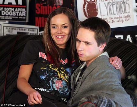 hannah sitting on joe's lap for a scene in the show inbetweeners 